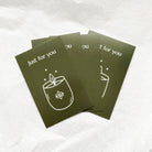 Stack of green cards with a candle illustration and 'Just for you' text on a white background