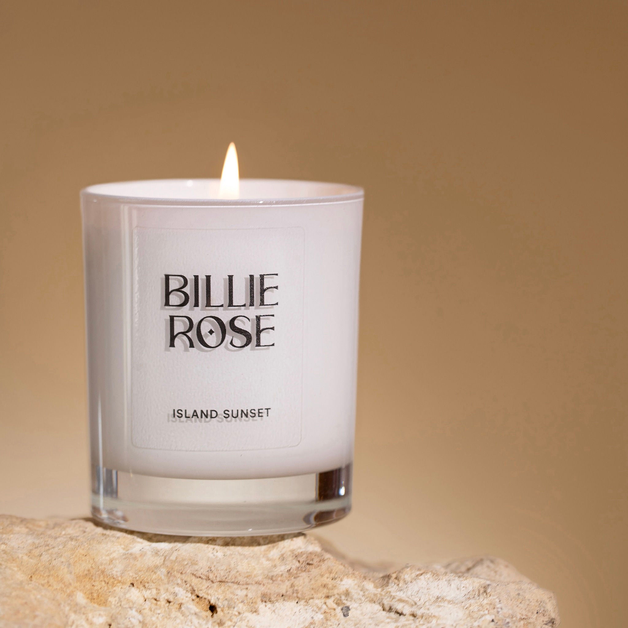 Candle with 'Billie Rose' branding on a beige background