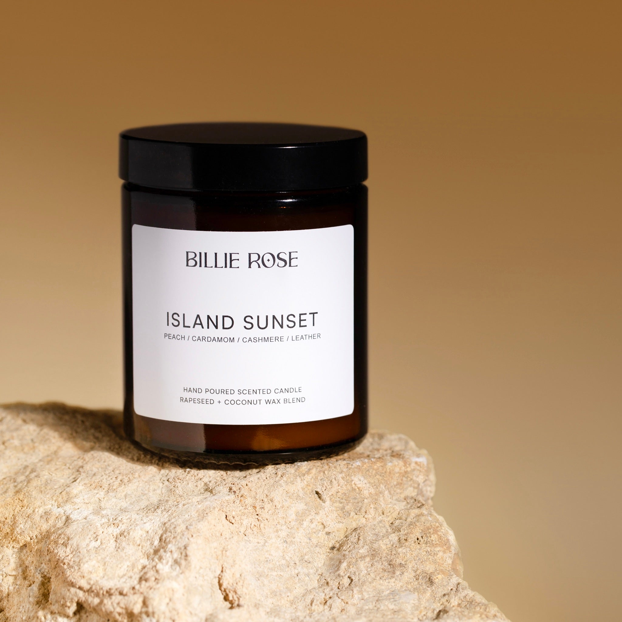 amber jar candle with lid on sunset style background