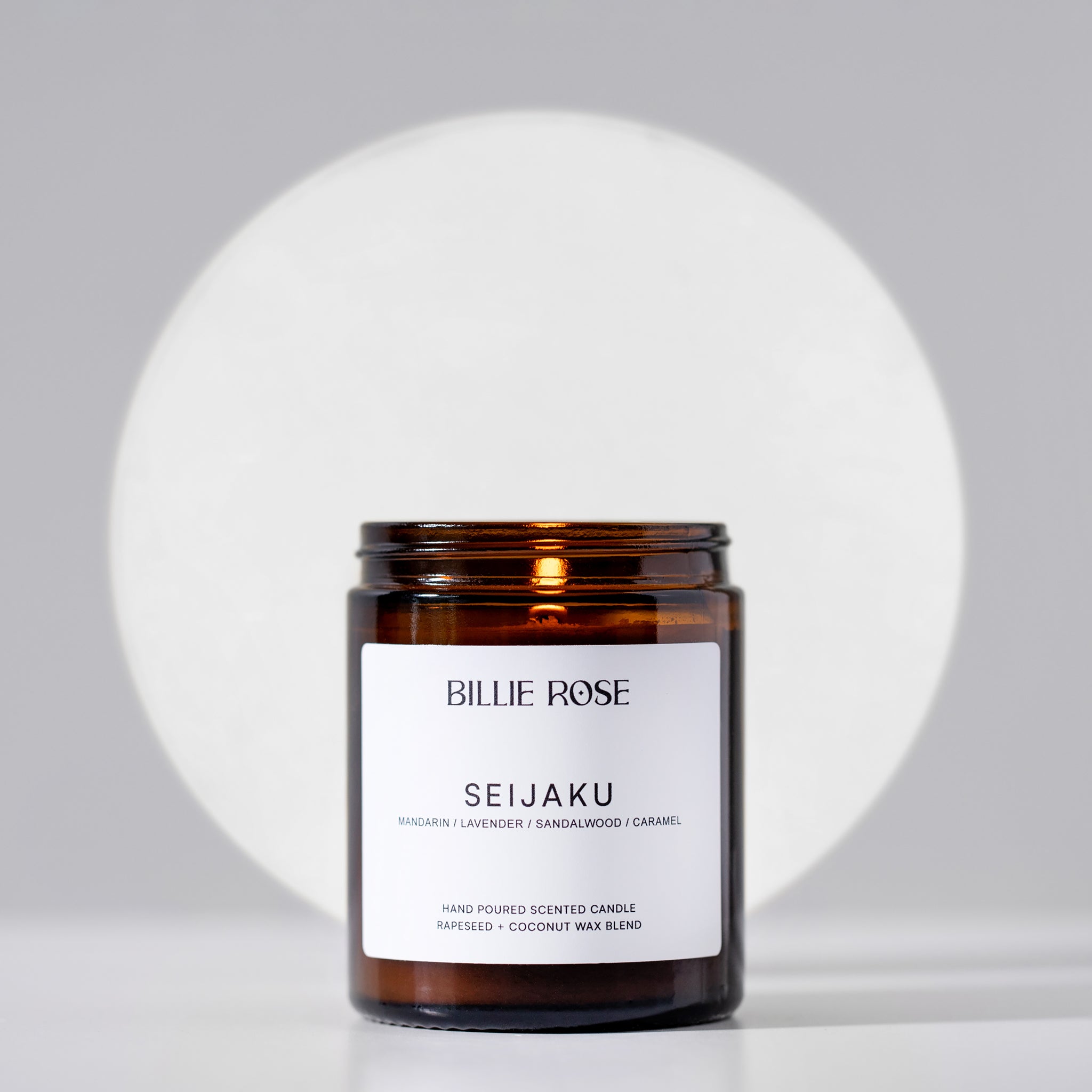 lit scented candle on calming background