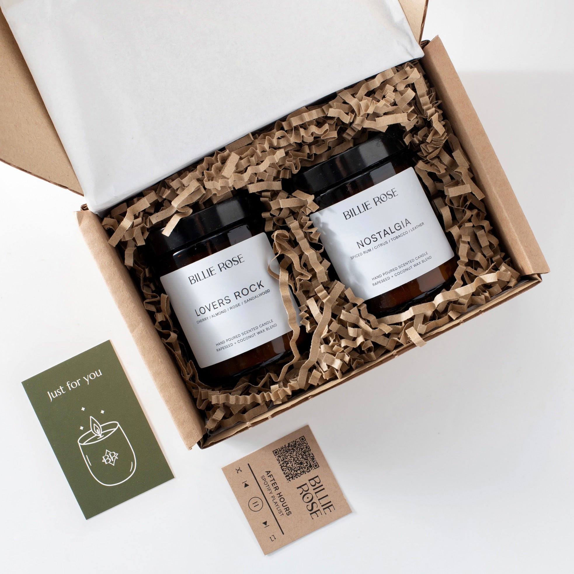 Two candles in a Billie Rose gift box with a gift card and playlist card on a white background.