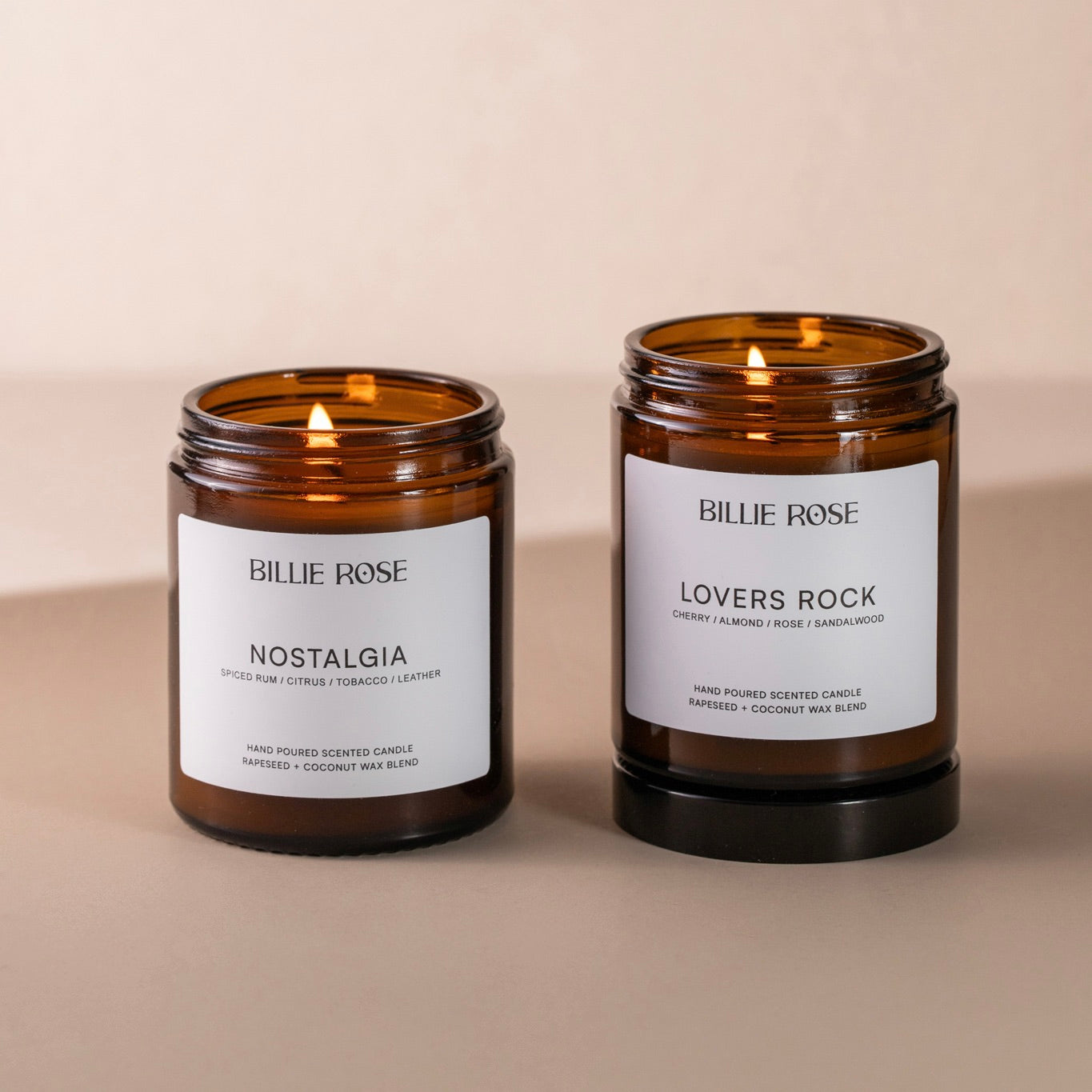 Two Billie Rose candles, 'Nostalgia' and 'Lovers Rock', on a beige background.