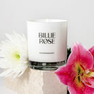 Billie Rose candle with flowers on a light background