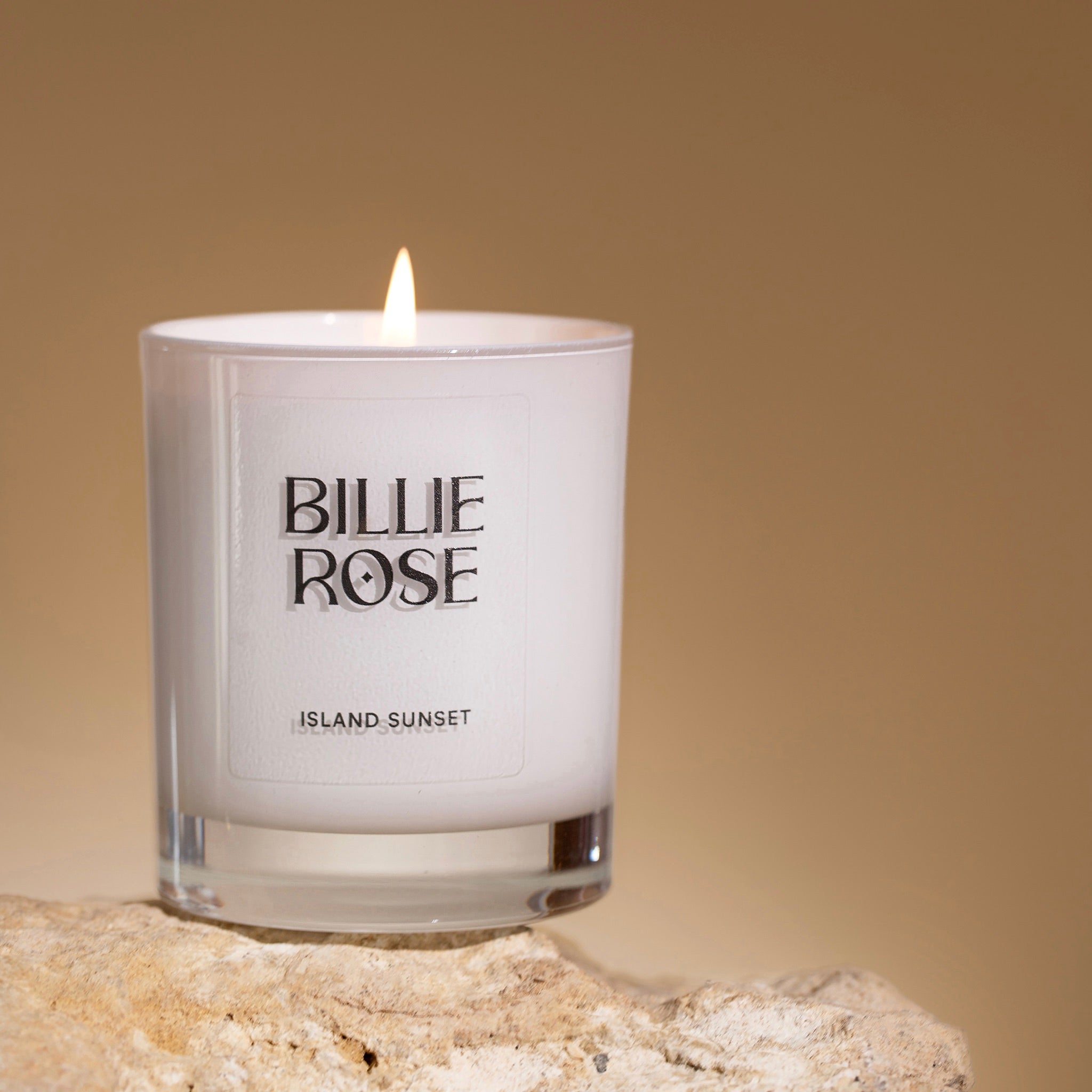 Island Sunset Candle with 'Billie Rose' branding on a warm orange background