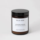 Lovers Rock scented candle on plain background