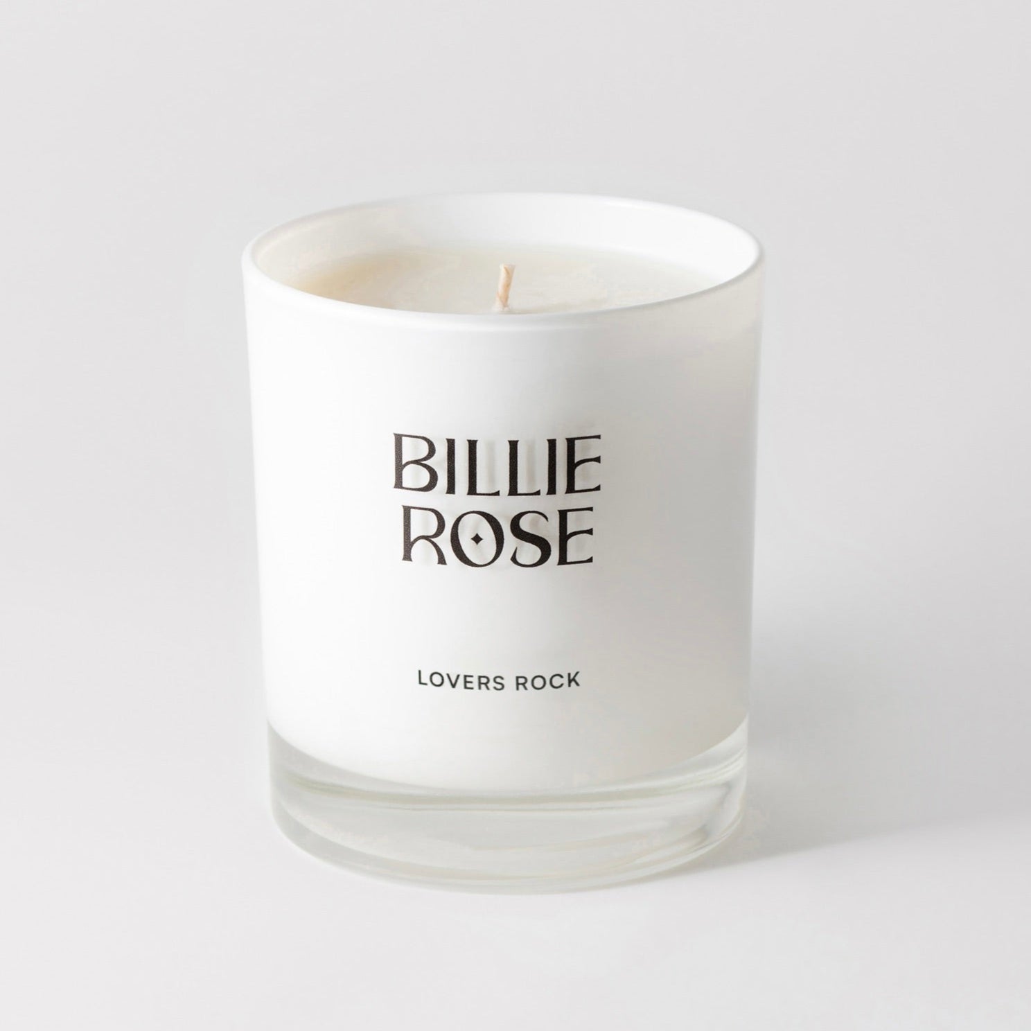 White candle with 'Billie Rose' branding on a light gray background