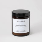 scented candle with lid on plain background