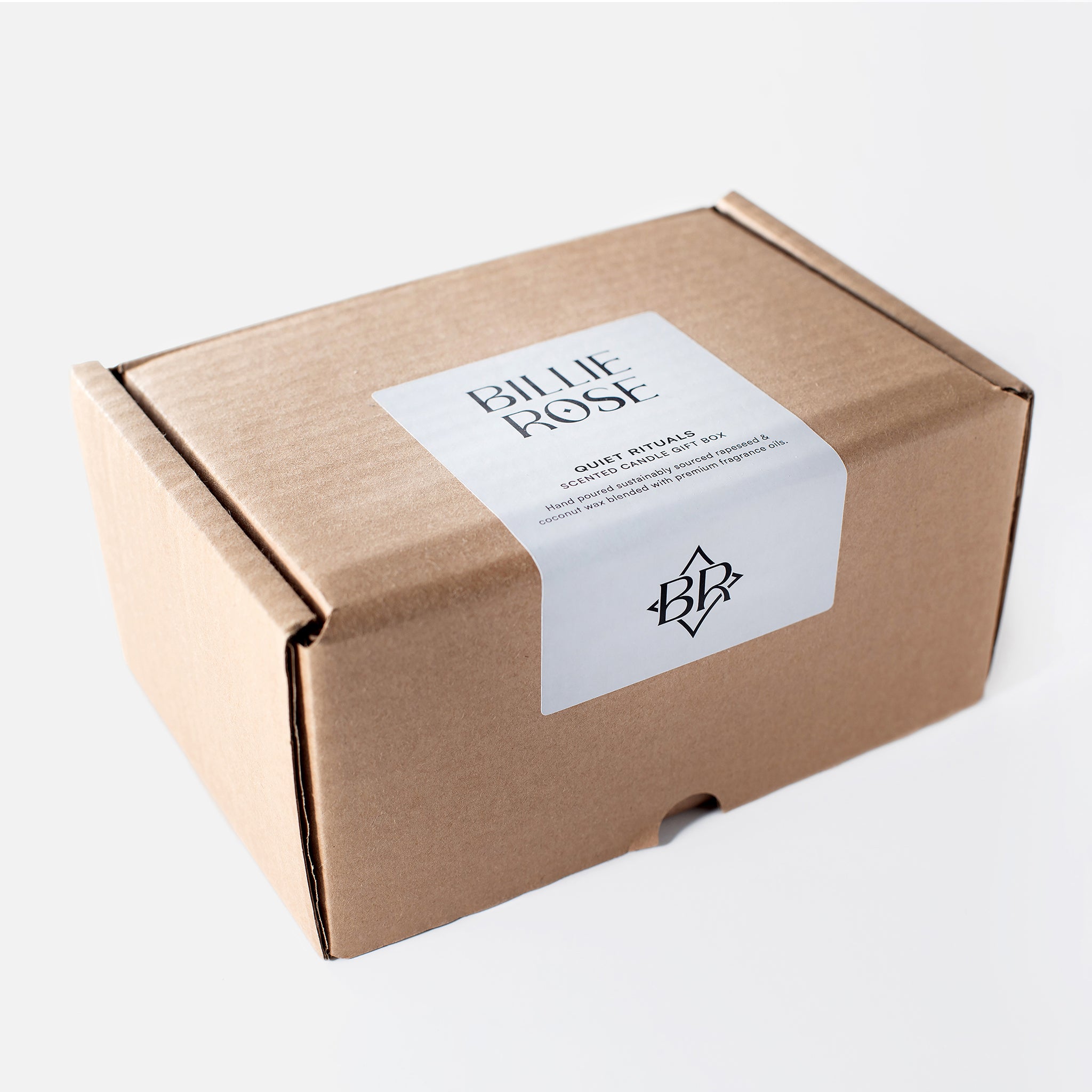 Brown kraft cardboard box with a 'Billie Rose' label on a white background
