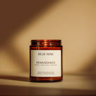 Candle jar labelled 'Billie Rose Renaissance' on a yellow beige background