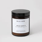 scented candle with lid on plain background