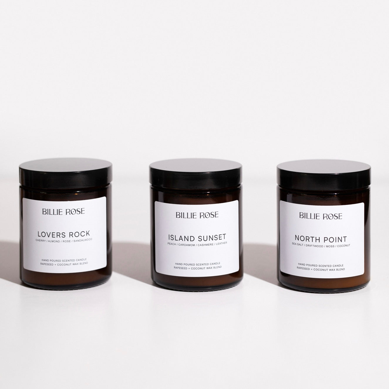 Three scented candles from Billie Rose on a white background