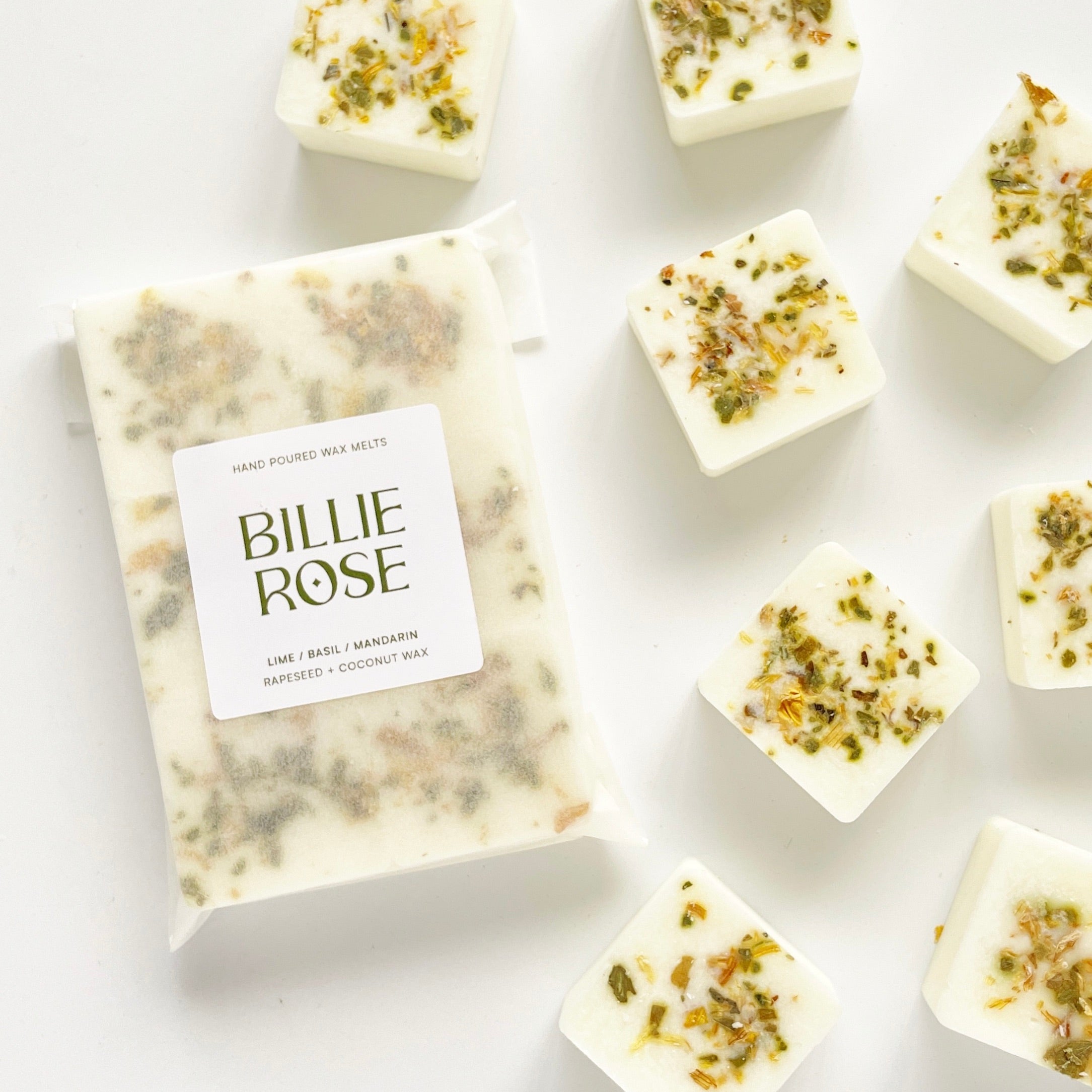packet of wax melts and loose wax melts decorated with dried botanicals