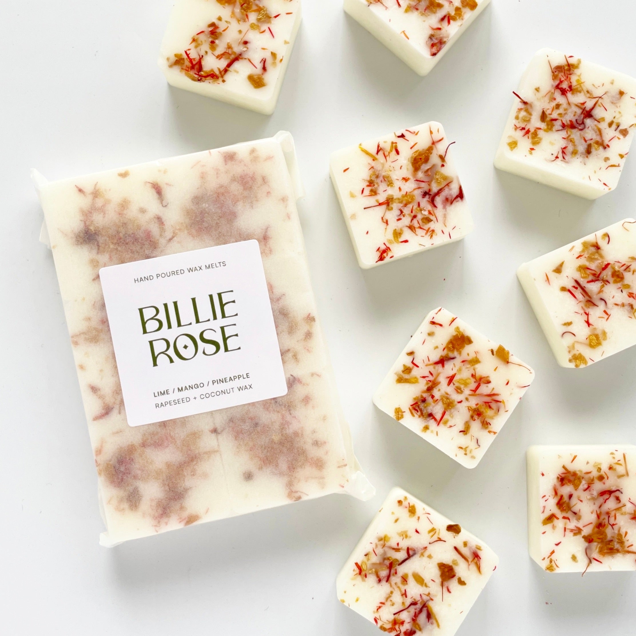 packet of wax melts and loose wax melts decorated with dried botanicals