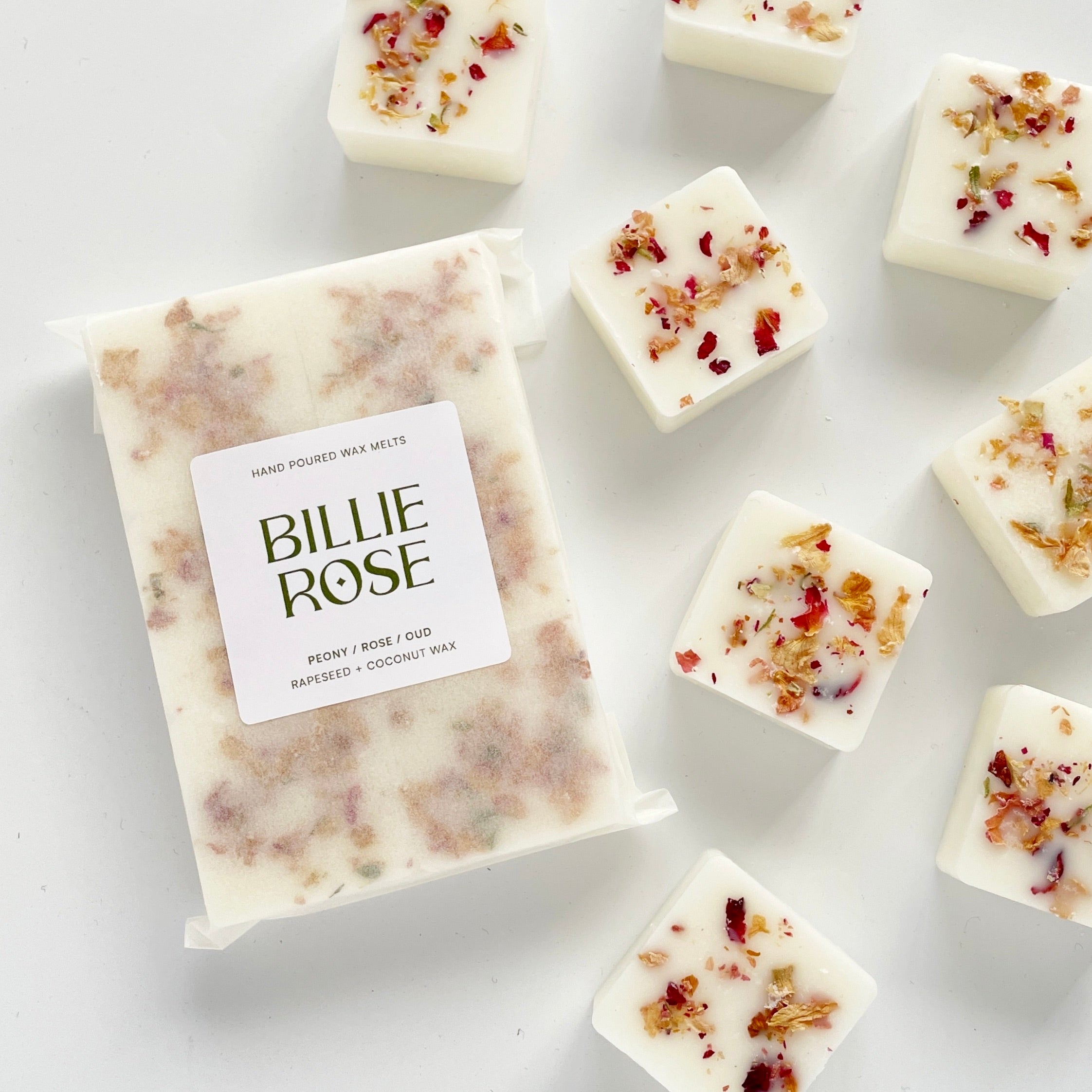 packet of wax melts and loose wax melts decorated with dried botanicals