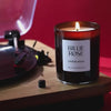 video of Billie Rose Lovers Rock candle on record player with red background and record spinning and flame gently flickering