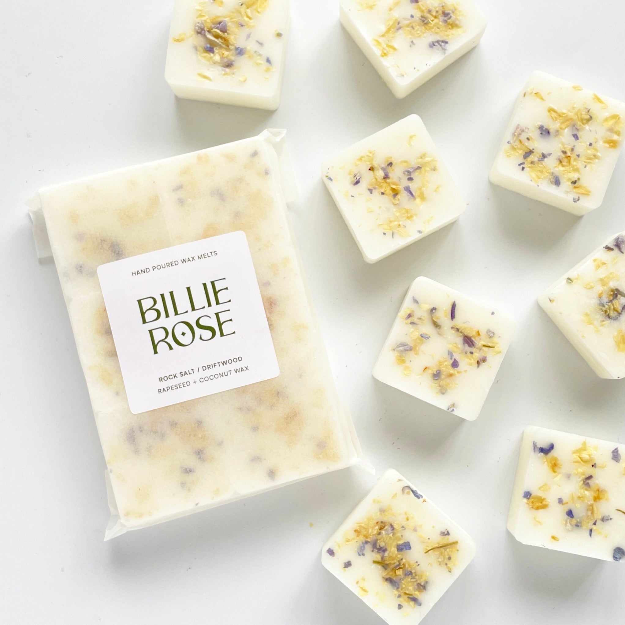 packet of wax melts and loose wax melts decorated with dried botanicals