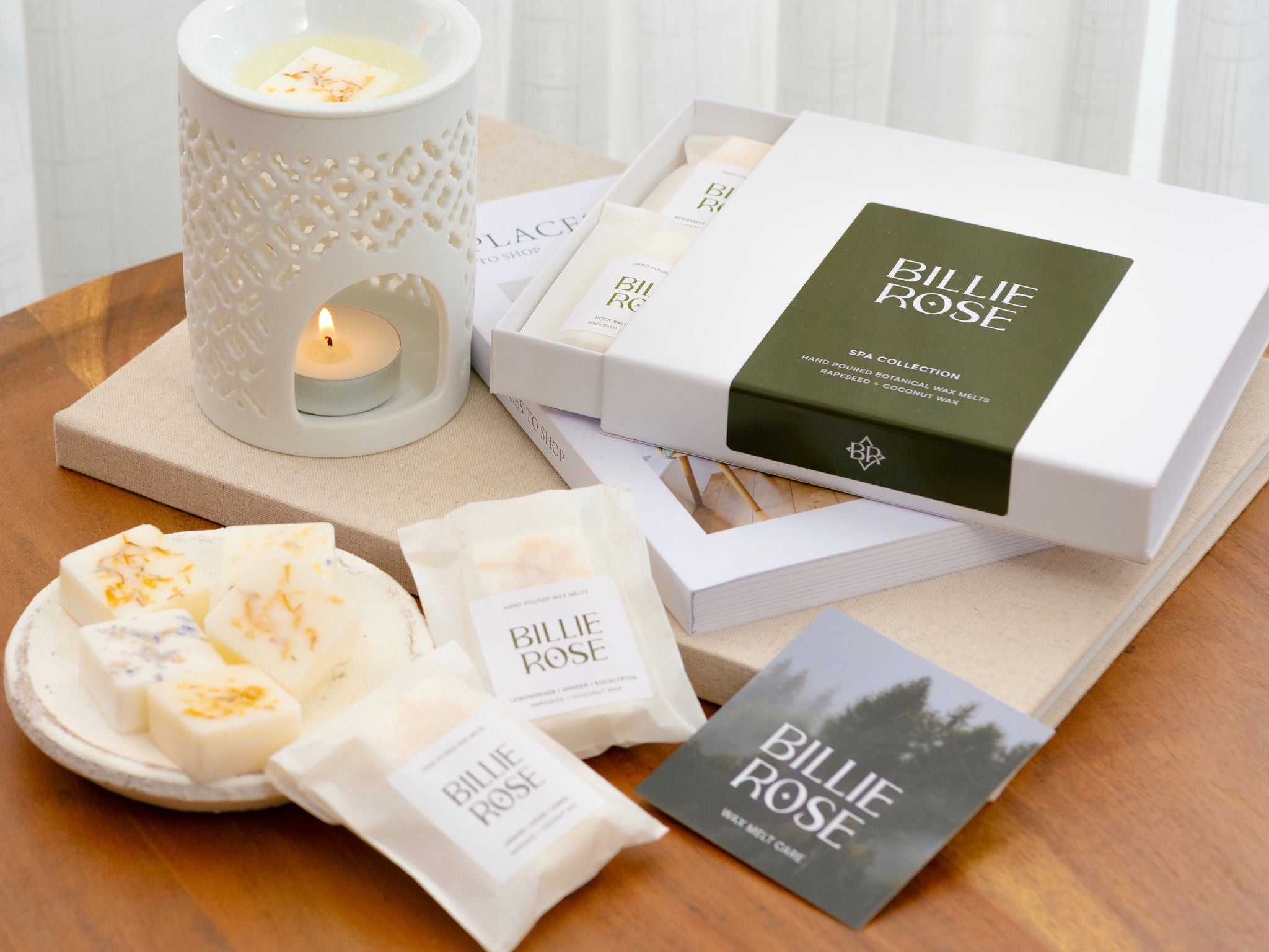 box of wax melts, lit wax melt burner, loose botanical wax melts